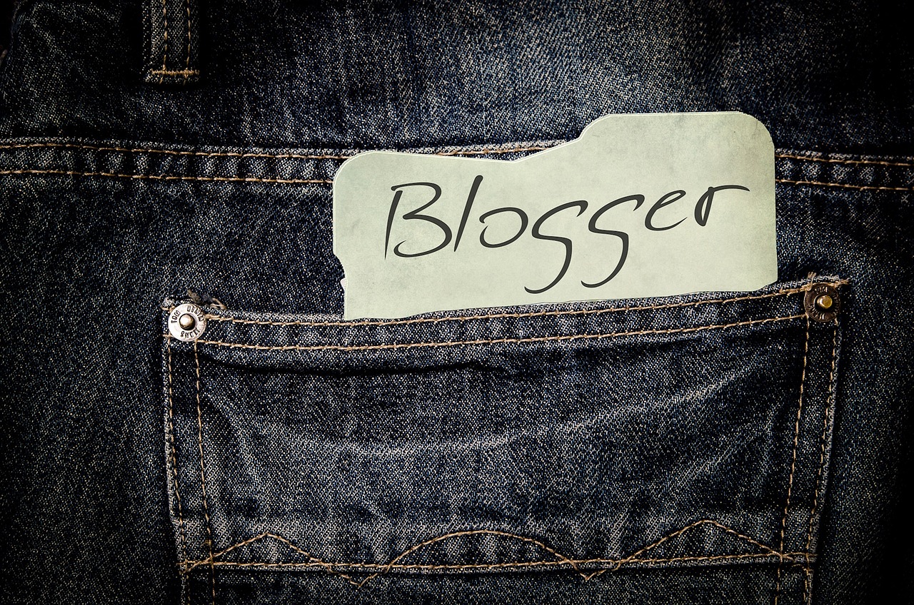 Picture of a pair of jeans with a sticky note in the back pocket showing this woman's new career as a blogger